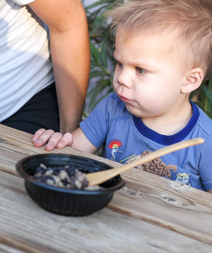 Toddler eating quinoa for breakfast
