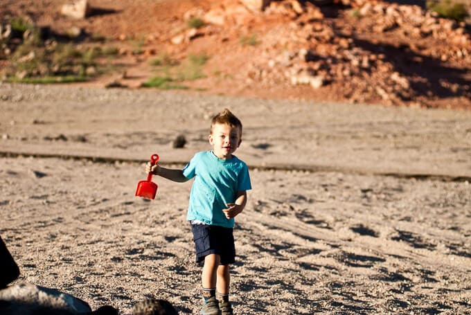 Some Boy playing around in the sand near the Hoover Dam