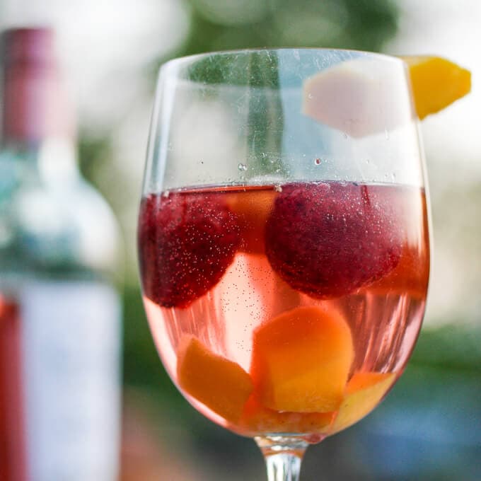 Strawberry mango sangria made with white or pink moscato for a light, refreshing drink