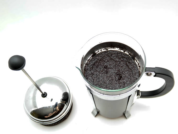 How to make perfect cold brew coffee overnight. You just need coffee, water and a french press. No french press? Steep in any glass container and strain through a fine-mesh sieve.