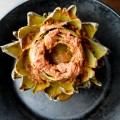 How to make easy Italian oven-roasted artichokes with three ingredients. Just pour some premade sauce over and cook. The flavors will seep in and the result is WAY better than boiling.