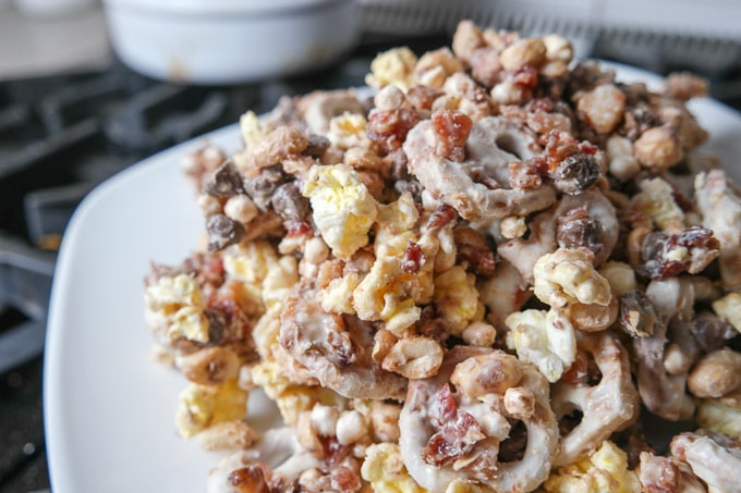 White chocolate bacon snack mix made with white chocolate-covered pretzels, diced bacon, semi-sweet chocolate chips, peanuts, mini marshmallows...this sweet and salty combo is a HUGE win in my house!