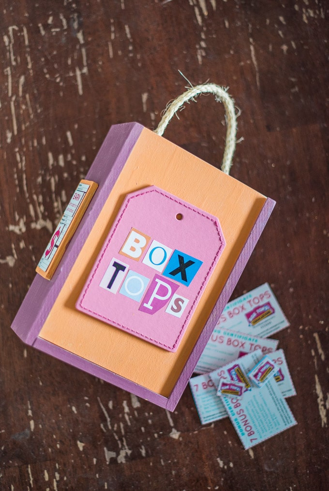 Crafting a Box tops box for collection in the classroom using an old wooden puzzle box.