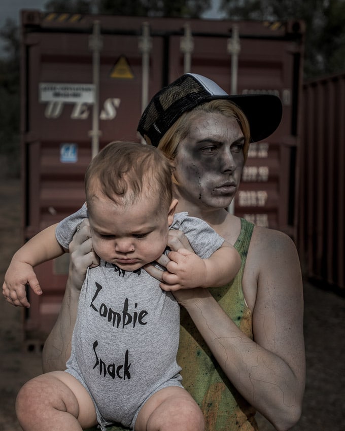 Mom and zombie baby dressed up to go trick-or-treating for Halloween.