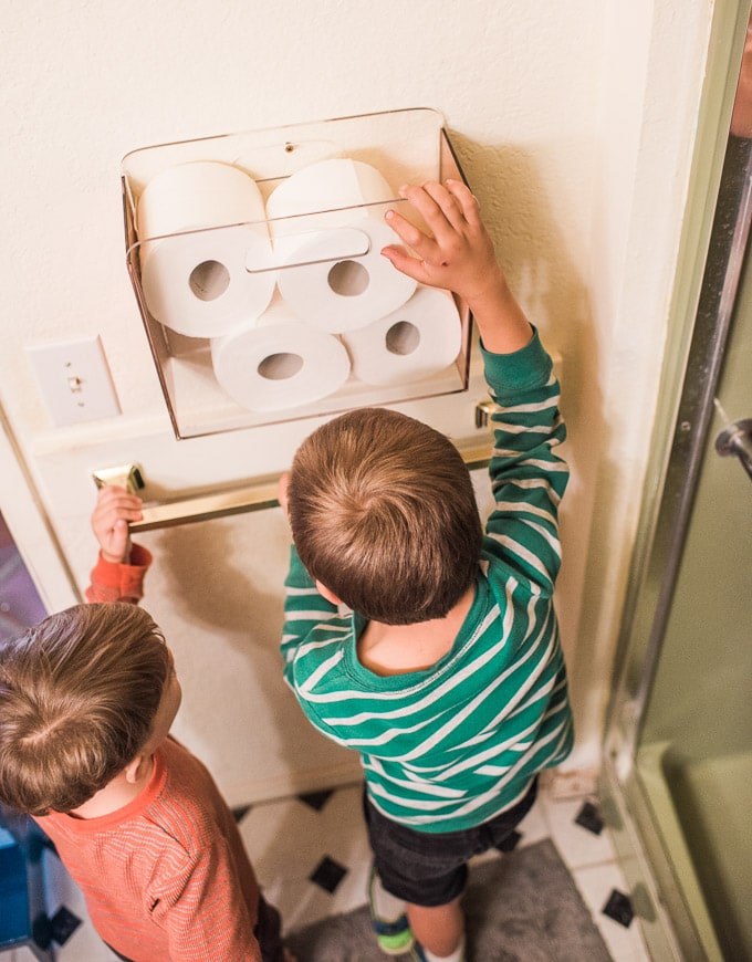 Keep a hanging rack of toilet paper on the wall to encourage kids to change the roll.