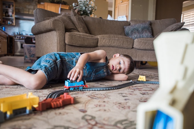 5-year-old playing with Thomas the Train set