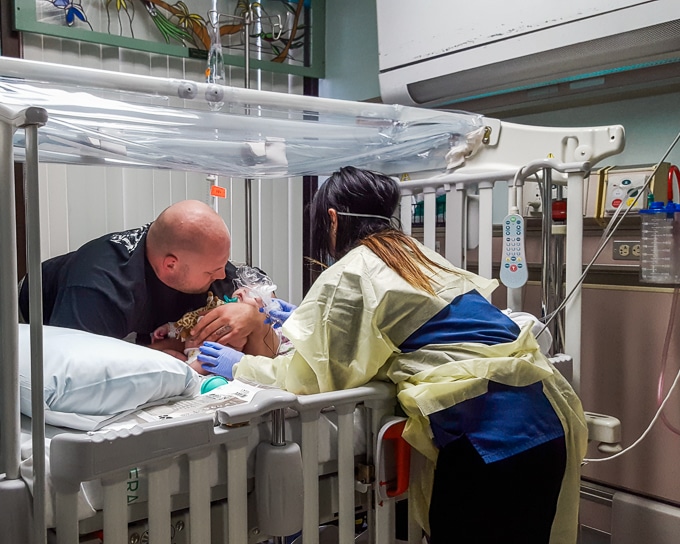 Dad caring for baby in hospital with RSV