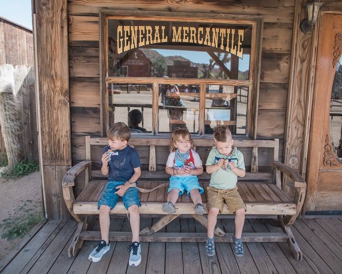 Snack time for 3 boys at the general mercantile store