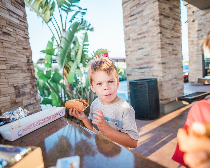 4-year-old eating a chili dog