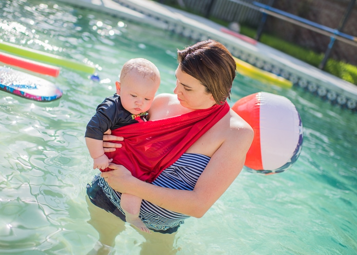 Mom wearing a water sling with baby