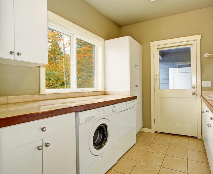 Another laundry room that is adjacent to the outdoors