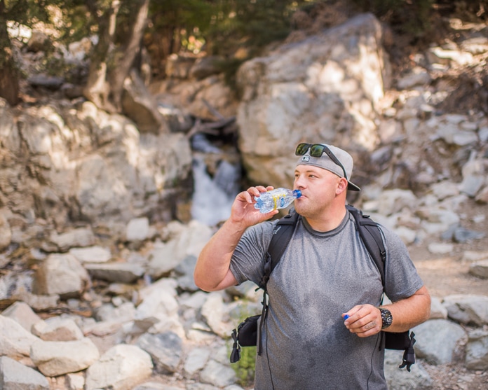 Stopping for a drink of Crystal Geyser near Big Falls in Big Bear