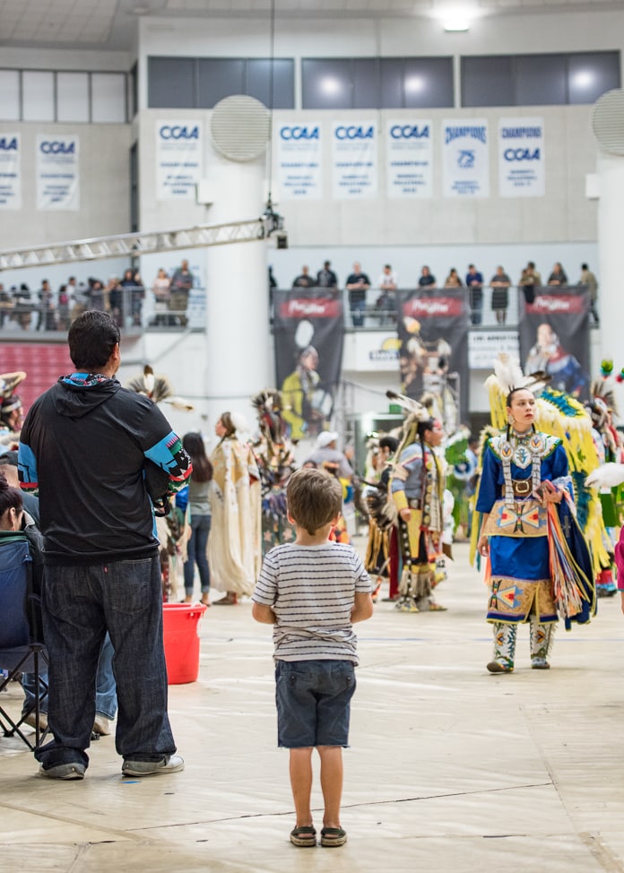 My son watching the Pow Wow from the sidelines