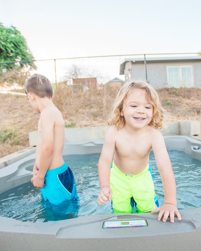 Toddler playing in a hot tub
