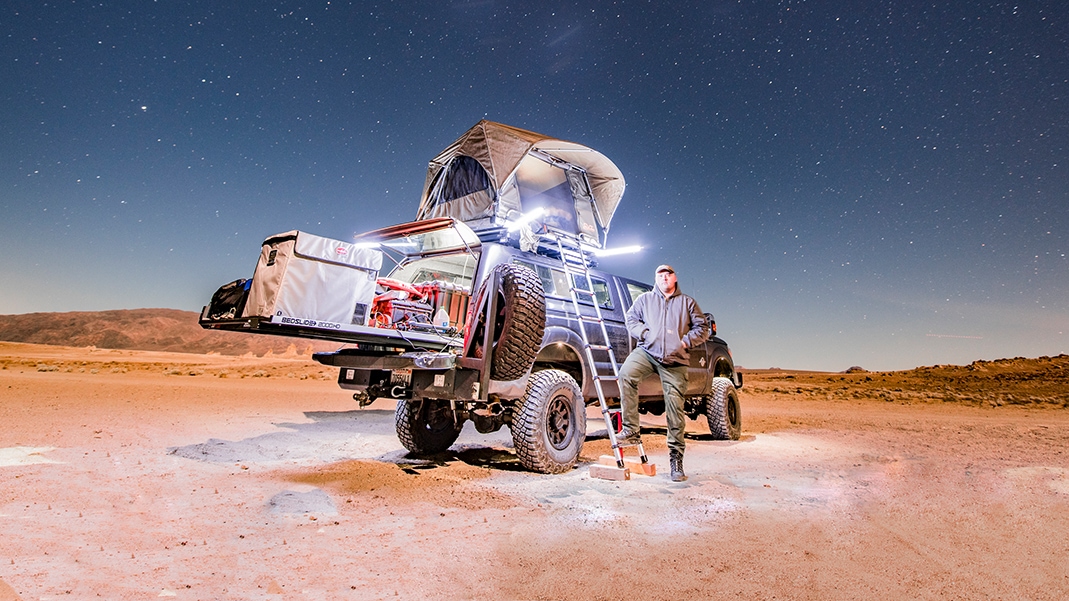 Adventure Ford truck under stary sky