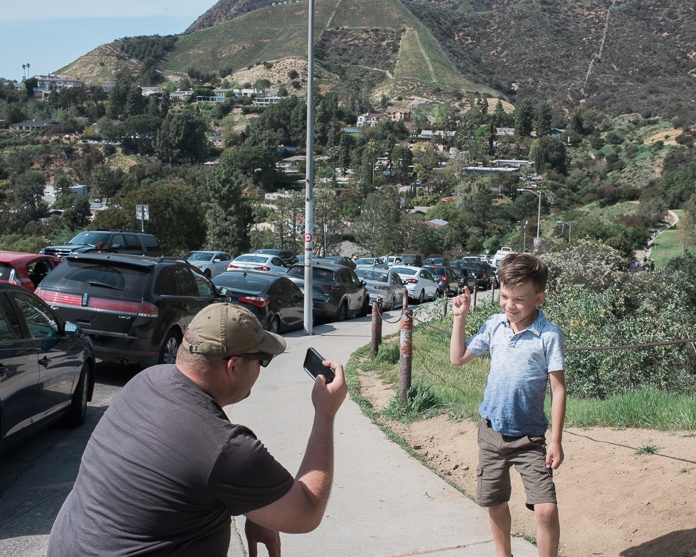 Between-the-fingers Hollywood sign photo setup