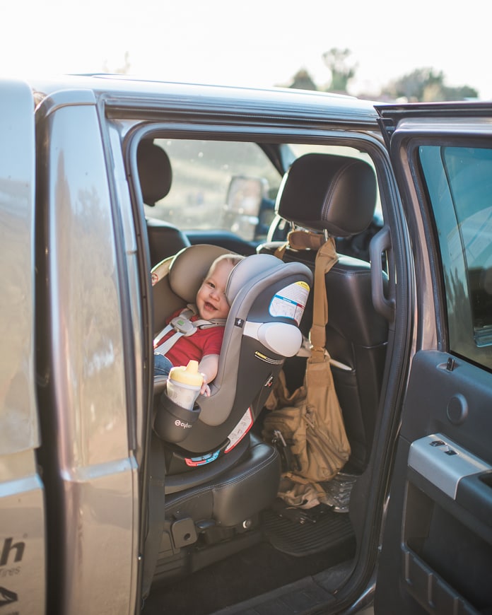 Baby in car seat in truck