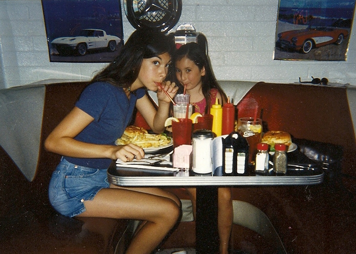 Sisters drink milkshake hamburger
