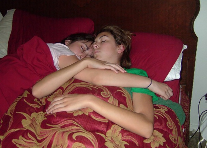 Sisters sleep together