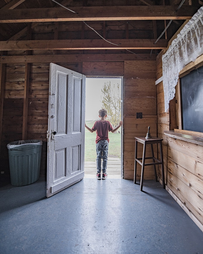 Boy standing in doorway