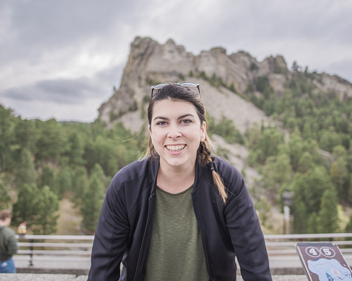 Woman in front of mount rushmore