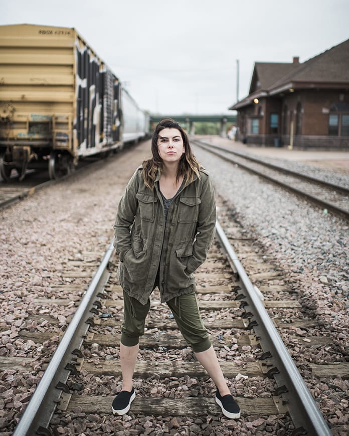 Woman on railroad tracks