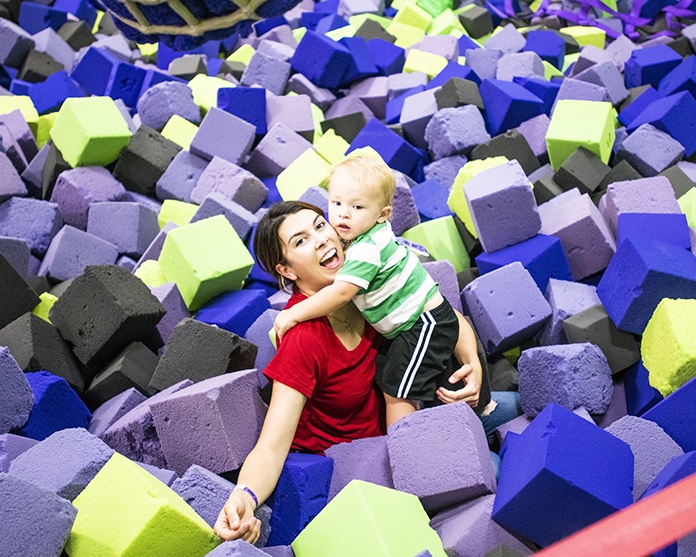 mother and baby in foam pit