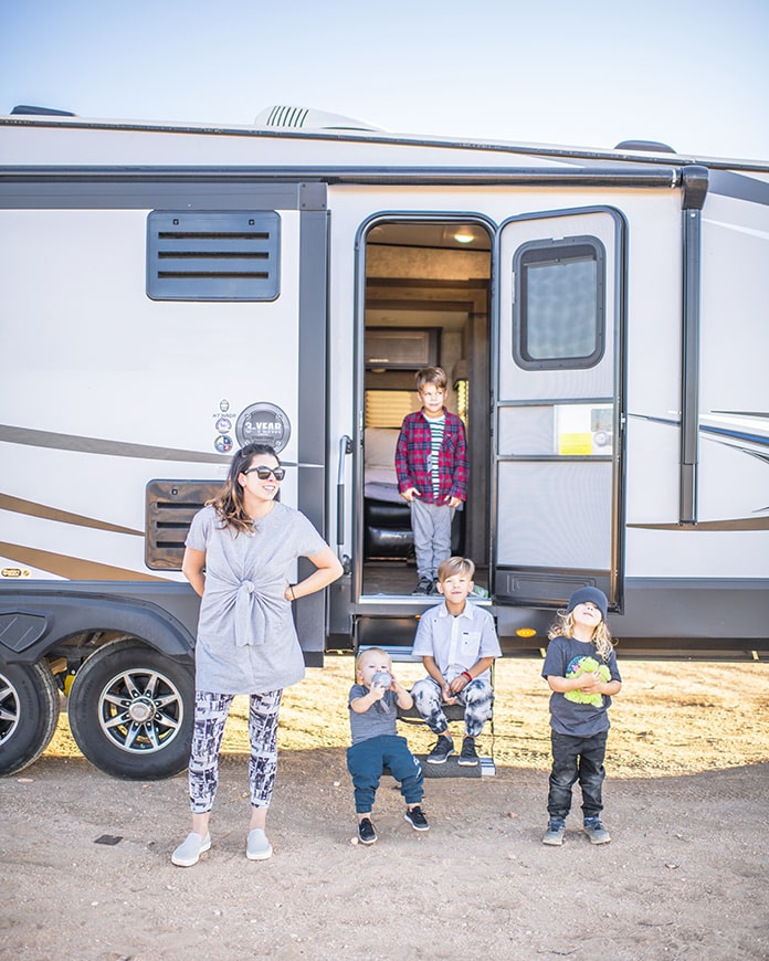 mother and kids next to an RV
