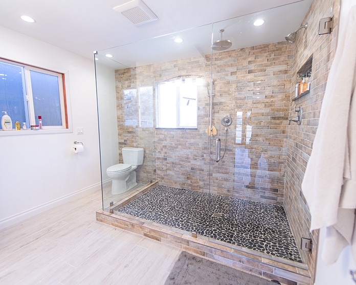 remodeled shower with glass wall