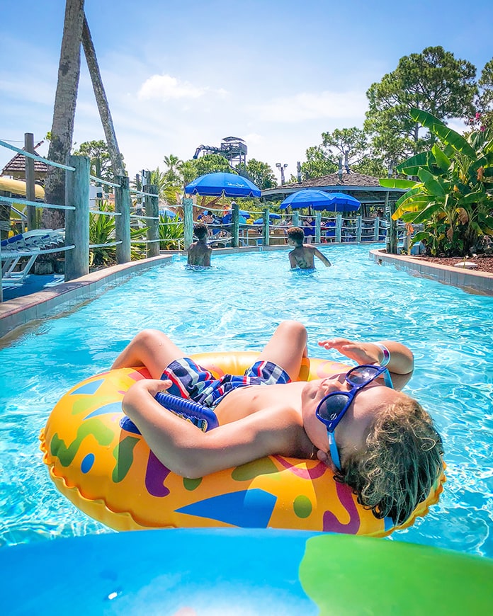 Child at best florida beach for kids relaxing on lazy river