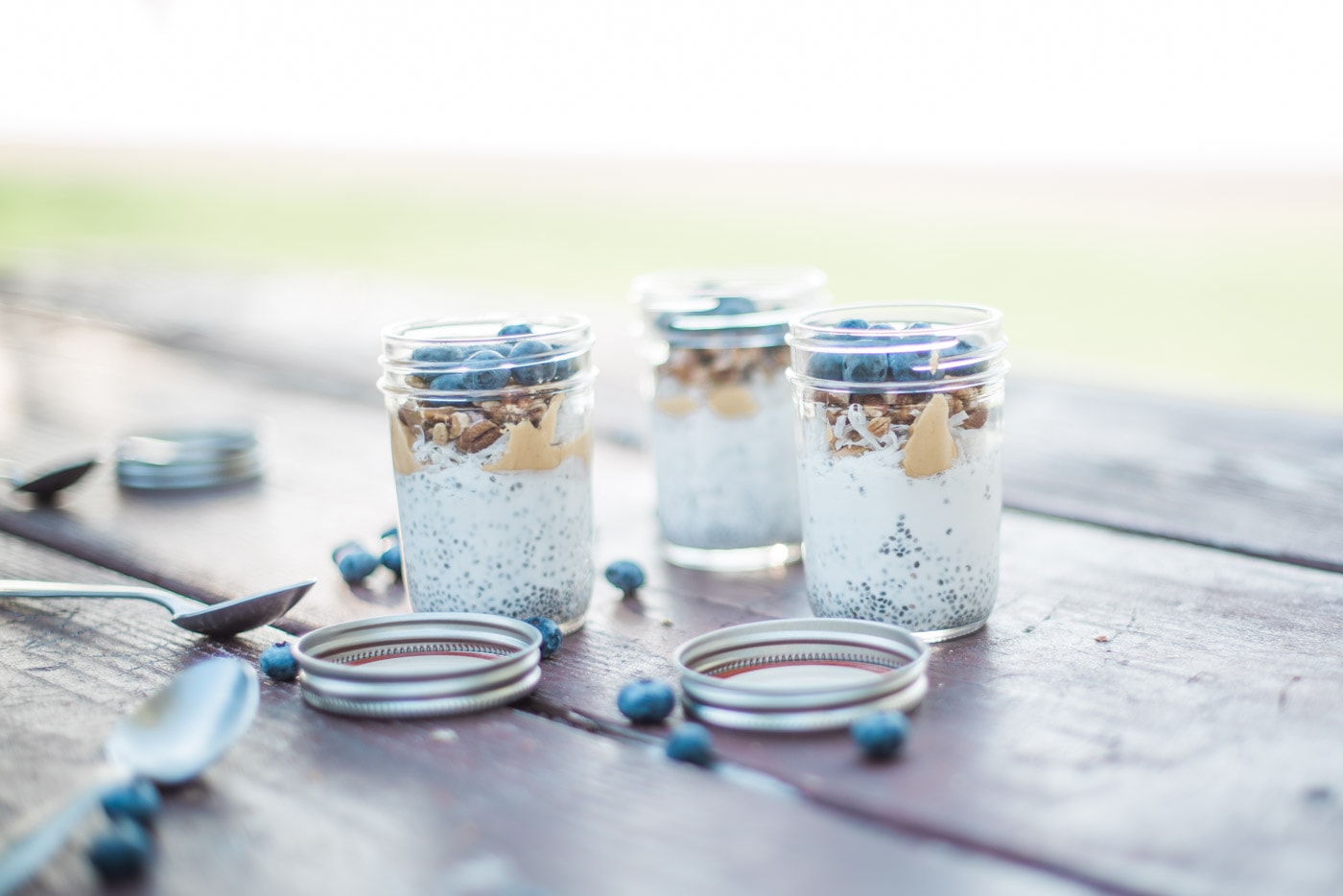 Layered chia pudding in a mason jar with almond butter
