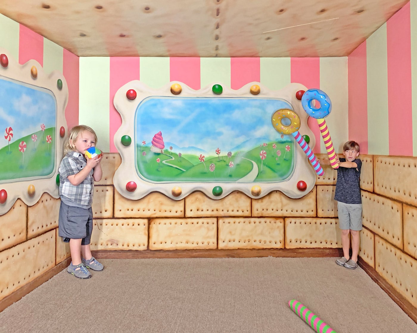 Toddler and preschooler in giant illusion room