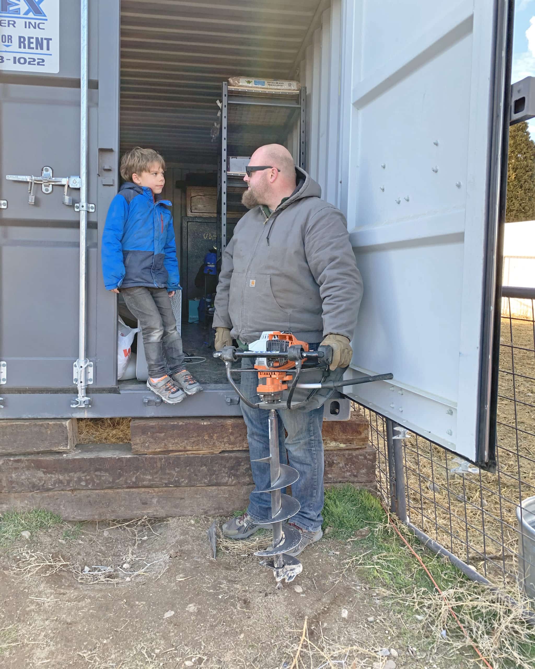 Elcih day and nate day with stihl auger in shipping container