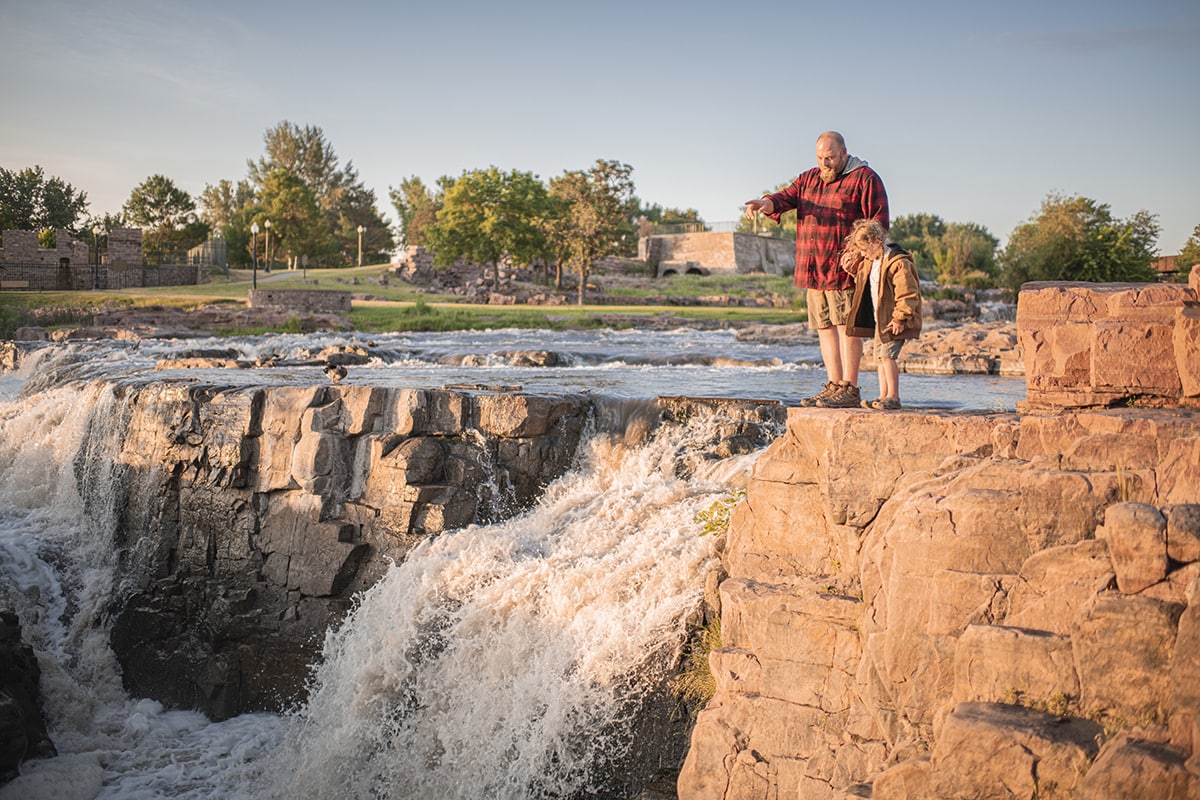 Father and son looking of sioux falls in south dakota