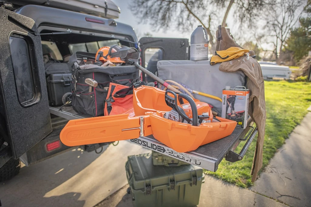Bedslide with stihl wood boss ms251 truck gear for overlanding