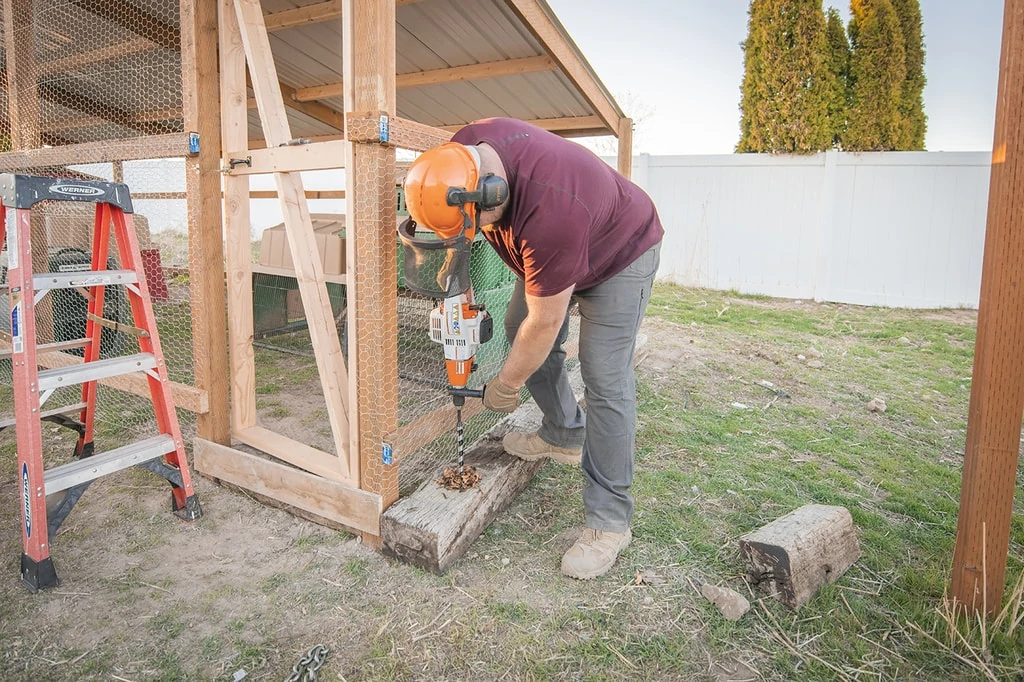 Using stihl bt 45 to bore through railroad ties to build easy diy chicken coop