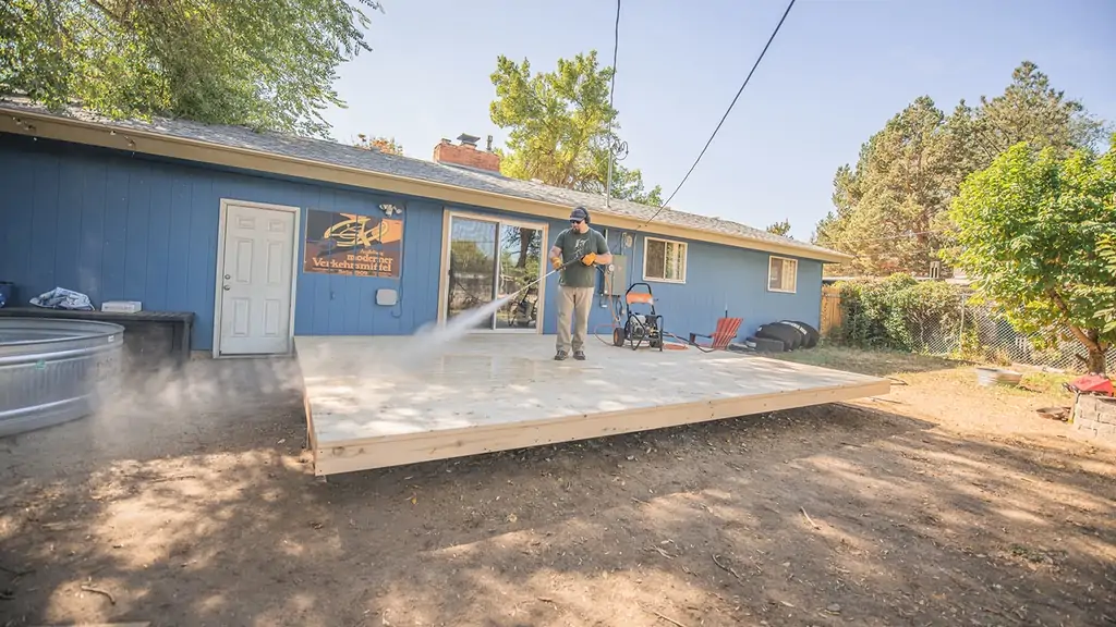 Nate Day using RB 600 pressure washing while installing a deck