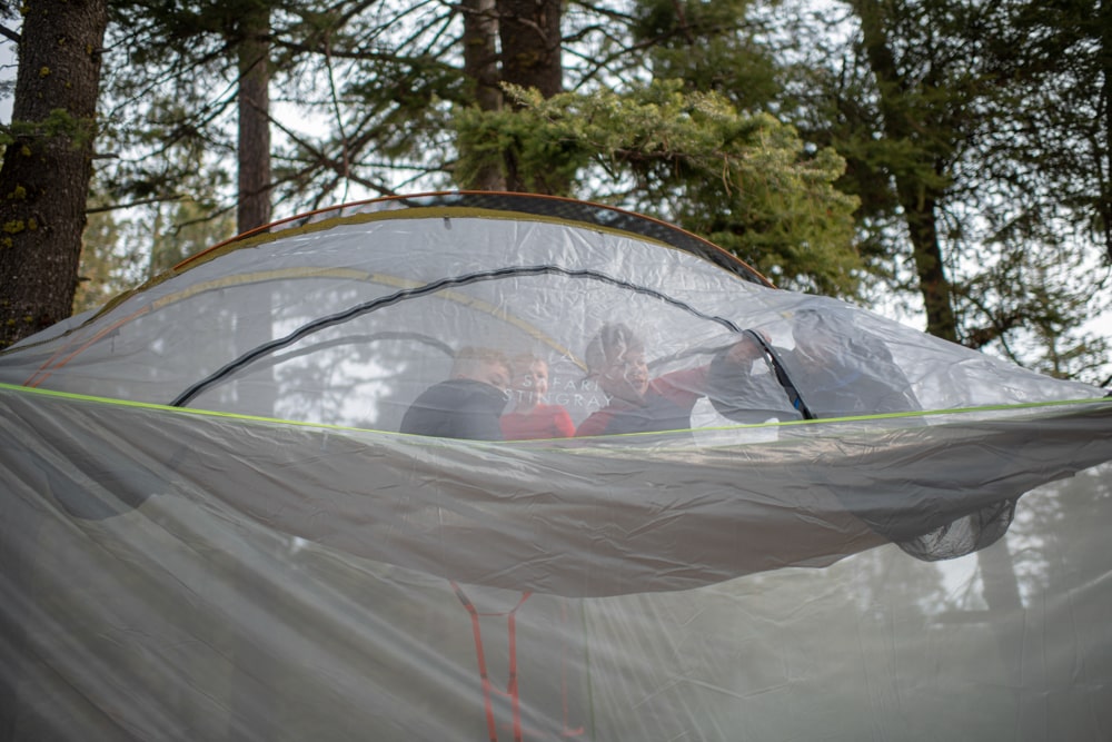 Unzipping the hanging tree tent flap