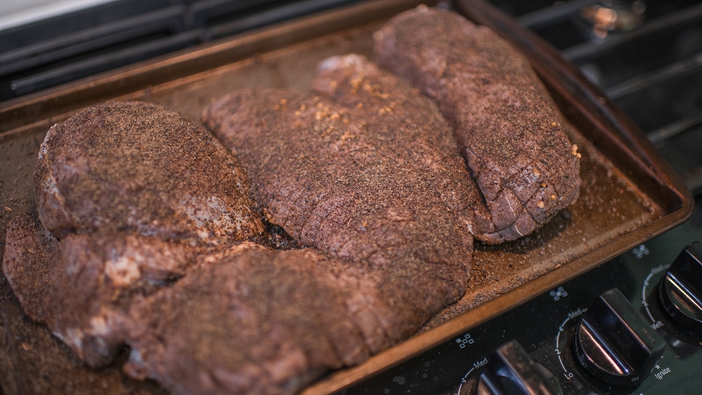 Making smoked venison with Treager dry rub