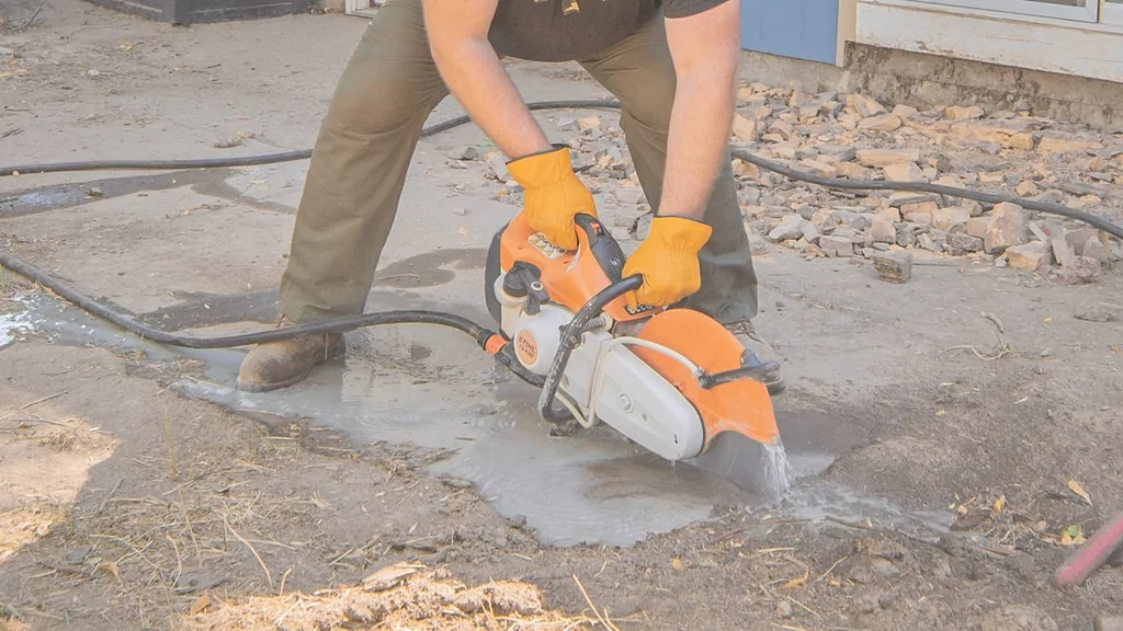 Nate day using a stihl ts 420 cutoff saw while installing a deck