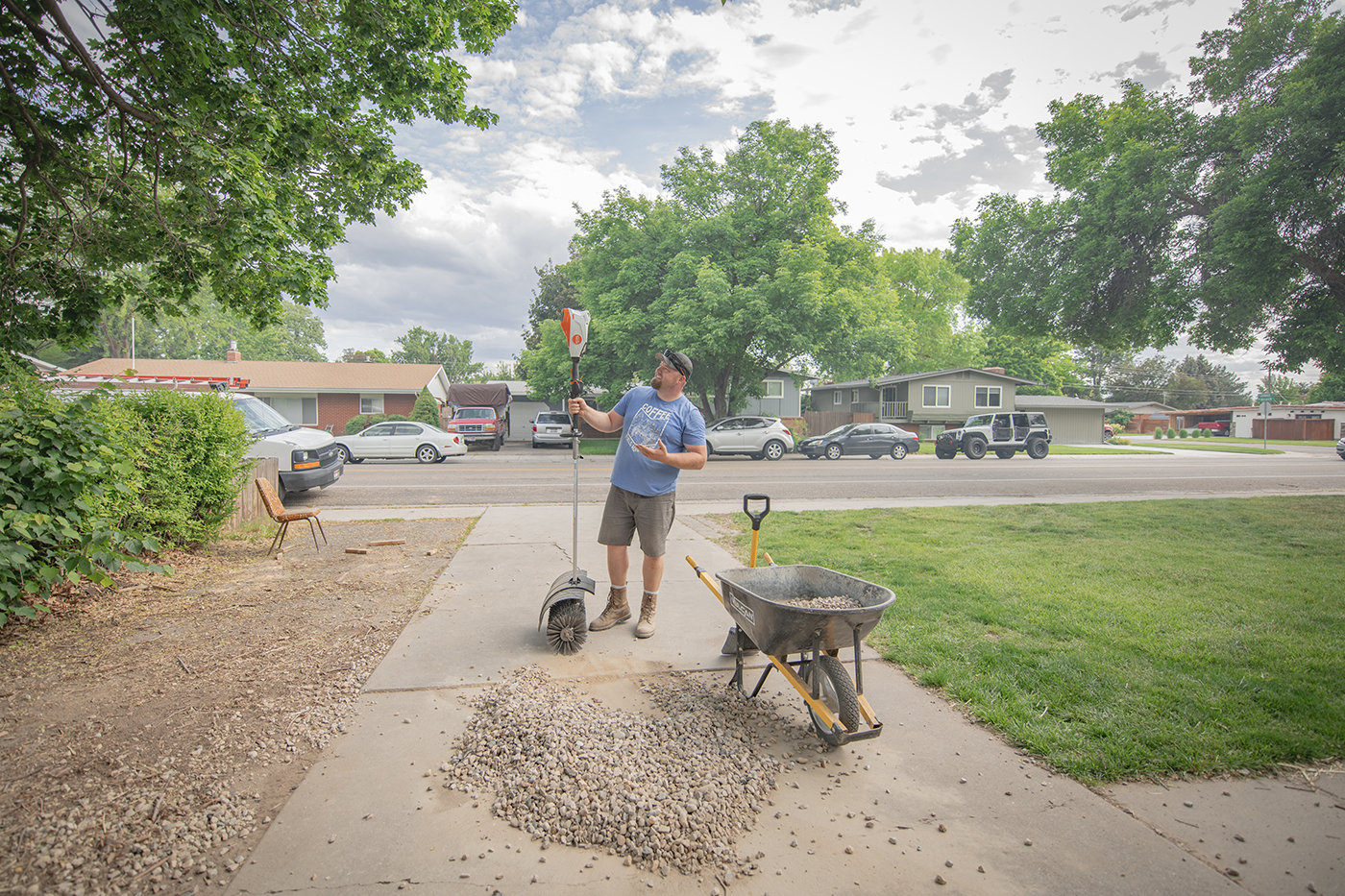 Nate day using stihl kma 135 r to clean up rocks in driveway easier