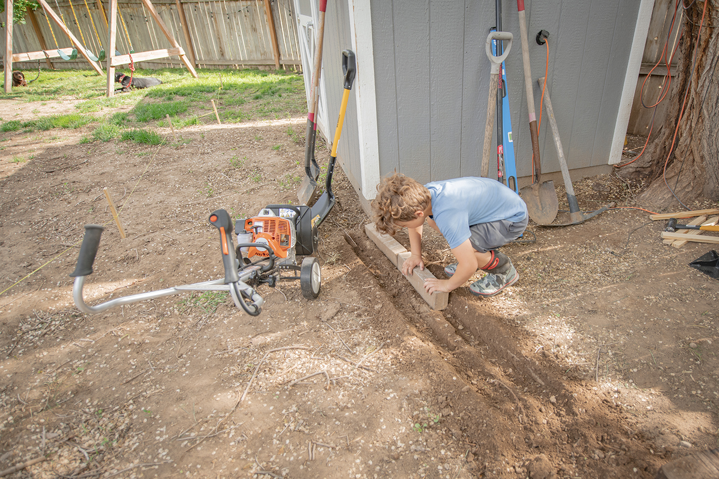Stihl mm 56 makes placing pavers easier when remodeling backyard space