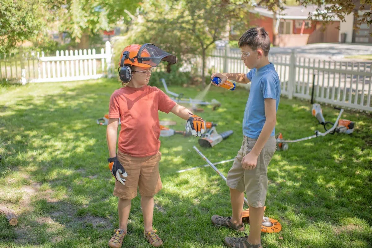 Two kids doing yard work